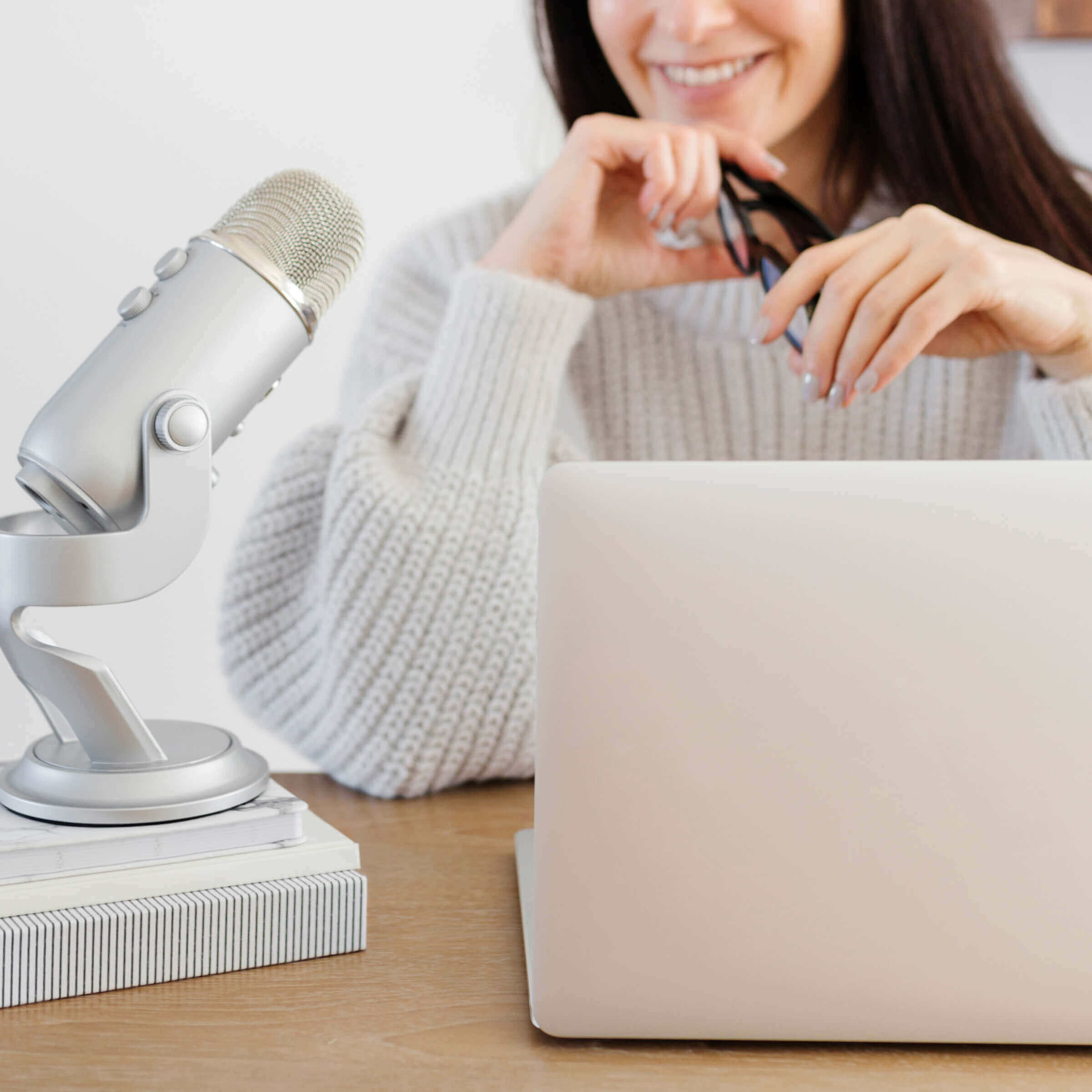 female entrepreneur web designer setting up google my business profile wearing a tan sweater