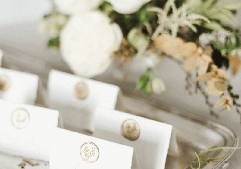 event planner display of namecards and flowers
