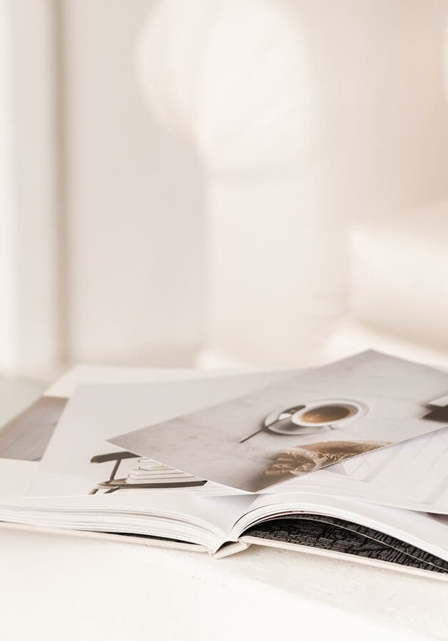 Seo-For-Interior-Designers Interior Designer At Home Studio With Pile Of Papers Working On Seo For Interior Designers